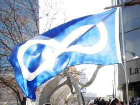 The Métis flag is waved in Manitoba in this 2006 file photo. (WAYNE GLOWACKI/WINNIPEG FREE PRESS)