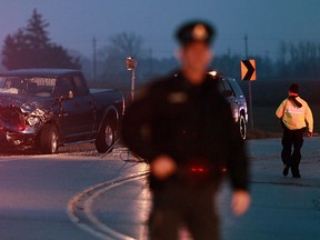 OPP officers investigate at the scene of a two vehicle accident on Walker Road near County Road 15 north of Harrow on Tuesday, January 29, 2013. (TYLER BROWNBRIDGE / The Windsor Star)