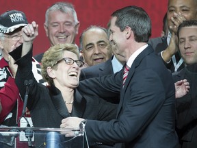 Kathleen Wynne is congratulated by outgoing Premier Dalton McGuinty after winning the leadership race at the Ontario Liberal Party leaderhip convention in Toronto on Saturday
(THE CANADIAN PRESS/Frank Gunn)
