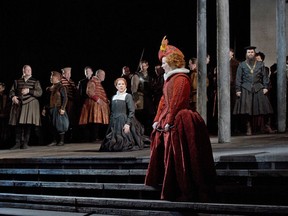 In this photo provided by the Metropolitan Opera,  Elza van den Heever, center right, sings the role of  Elisabetta with Joyce DiDonato, center left, in the title role during a dress rehearsal of Donizetti's "Maria Stuarda," at the Metropolitan Opera in New York. (AP Photo/Metropolitan Opera, Ken Howard)