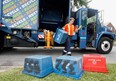 City of Windsor recycle truck operator Chet Salisbury picks up a heavy load on Cameron Avenue, Tuesday July 13, 2010. (Windsor Star files)