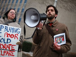 Files: Lorena Shepley from Voices Against Poverty, left, and Adam Vasey, Director at Pathway to Pontential, speak to a crowd of approximately 60 people outside City Hall in this 2011 file photo. (DAX MELMER / The Windsor Star)