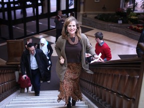 Sandra Pupatello climbs the steps of the Caboto Club in Windsor, Ont. on Jan. 13, 2013. (Dax Melmer / The Windsor Star)