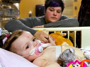 Baby Grace Nightingale has her soother replaced by mother Lacey Nightingale at The Hospital for Sick Children in Toronto, Ontario Friday jan. 18 (Tim Fraser for Windsor Star)