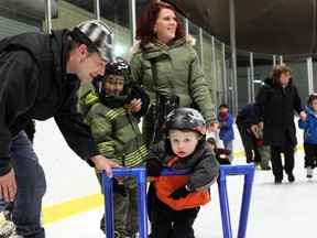 Two-year-old Rocco Richards braces himself as he attempts to skate at Lanspeary Park on Saturday, Dec. 31, 2011. Rocco, his brother Ivano, and parents Jamie and Marianna were among the hundreds who filled the park to participate in free skating, live music and a fireworks display. (DYLAN KRISTY/The Windsor Star).