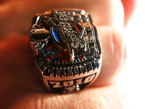 A Member of the 10 Memorial Cup champion Windsor Spitfires displays his new championship rings after they were presented to the team at The Franchise restaurant on Lauzon Road in Windsor, Ont., on Aug., 14, 2010.  (JASON KRYK/ THE WINDSOR STAR)