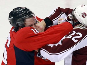 Windsor's Kerby Rychel, left, and Peterborough's Nelson Armstrong fight at the WFCU Centre in Windsor on Thursday, January 31, 2013. (TYLER BROWNBRIDGE/The Windsor Star)