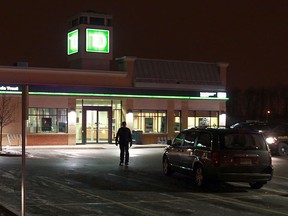 OPP officers investigate at the scene of a robbery at the TD Canada Trust bank on Tecumseh Road east of Banwell Road in Tecumseh on Thursday, January 31, 2013.         (TYLER BROWNBRIDGE / The Windsor Star)