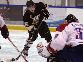 LaSalle's Blake Jones, left, fires a shot at Strathroy's Dalen Kuchmey at the Vollmer Centre in LaSalle on Wednesday, January 16, 2013. The Vipers won 5-1. (TYLER BROWNBRIDGE / The Windsor Star)