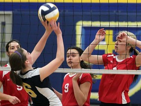 St. Joseph's Chloe Stachow, left,  returns the ball against Holy Names players Carly Steer, behind right, Carlie Trombley and Jacqueline Le Claire in volleyball action from St. Joseph Thursday January 17, 2013. (NICK BRANCACCIO/The Windsor Star