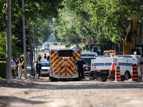 Emergency services personnel tend to a patient following an industrial accident involving a construction worker and a front-end loader on the 1200 block of McKay Avenue on Wednesday, June 1, 2011. (DYLAN KRISTY/The Windsor Star)