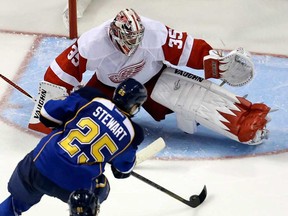 St. Louis' Chris Stewart scores on Detroit goalie Jimmy Howard during the third period of an NHL hockey game Saturday, Jan. 19, 2013, in St. Louis. The Blues won 6-0. (AP Photo/Jeff Roberson)