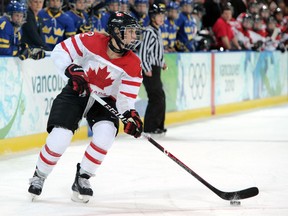 File photo: Meghan Agosta of Canada controls the puck during the ice hockey women's preliminary game between Canada and Sweden on day 6 of the 2010 Winter Olympics at UBC Thunderbird Arena on February 17, 2010 in Vancouver, Canada.  (Photo by Harry How/Getty Images)