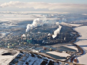 Oil sands refinery business Suncor Energy, Inc.an upgrading plant near Fort McMurray, Alberta, Canada, is pictured from the air Monday, March 6, 2006. (Bloomberg files)