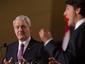 Marc Garneau, left, and Justin Trudeau take part in the Liberal leadership debate in Mississauga on Saturday, Feb. 16, 2013. THE CANADIAN PRESS/Chris Young