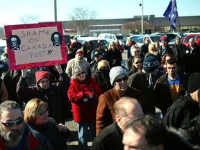 Approximately 200 people attend a rally outside Windsor's mail-sorting plant on Walker Road,  Saturday, Feb. 9, 2013. People were protesting Canada Post's proposed service reductions and closure of the historic Sandwich post office. (DAX MELMER/The Windsor Star)