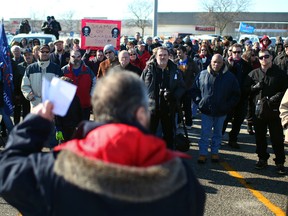 Zeon Bouvier, centre, regional representative for the Canadian Union of Postal Workers, speaks at a rally outside Windsor's mail-sorting plant on Walker Road,  Saturday, Feb. 9, 2013. (DAX MELMER/The Windsor Star)