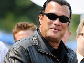 Actor Steven Seagal, best known for his roles in movies such as "Above the Law" and "Under Siege," is joining forces with the self-proclaimed "America's Toughest Sheriff" to train volunteer armed posse members to defend Phoenix-area schools against gunmen. (Postmedia News files)
