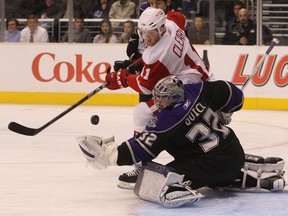 Detroit's Dan Cleary, left, is stopped by Kings goalie Jonathan Quick at the Staples Center. (Photo by Bruce Bennett/Getty Images)