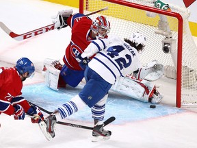 Toronto's Tyler Bozak, right, scores a goal on Montreal's Carey Price Saturday at the Bell Centre. (John Kenney/THE GAZETTE)