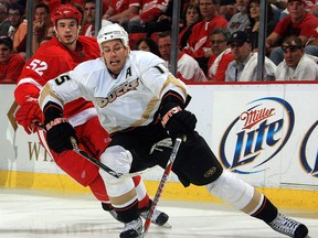 Anaheim's Ryan Getzlaf, right, is checked by Detroit's Jonathan Ericsson. (Photo by Dave Reginek/NHLI via Getty Images)