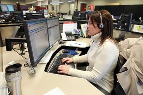 Denise Meloche answers a call during an open house at the 211/311 call centre at 400 City Hall Square in Windsor in February 2013. Letter writer Jerry Gervais is grateful for the service.  (Windsor Star files)