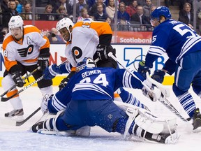 Philadelphia's Wayne Simmonds, centre, scores on Toronto goaltender James Reimer during the first period Monday. (THE CANADIAN PRESS/Chris Young)