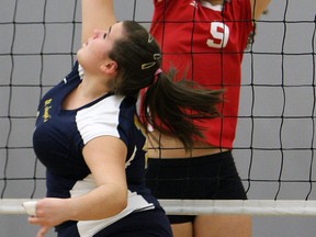 Carlie Trombley, right, of Holy Names blocks a shot by St. Joseph's Sabrina Rachetti at St. Joseph high school. (TYLER BROWNBRIDGE/The Windsor Star)