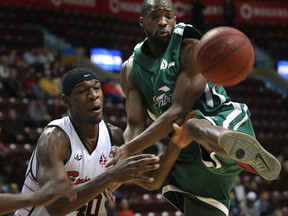 Windsor's Lester Prosper, left, and Montreal's J.R. Harrison battle for the ball Wednesday at the WFCU Centre. (DAN JANISSE/The Windsor Star)