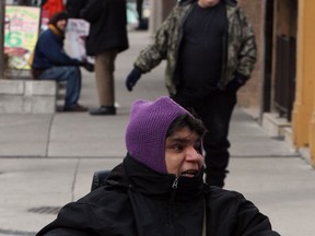 Ouellette Avenue panhandlers Nicky, front and panhandler known as Sign Man, behind left, ask for donations on Ouellette Avenue Friday afternoon February 15, 2013.  (NICK BRANCACCIO/The Windsor Star).