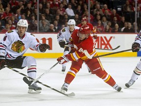 Jiri Hudler #24 of the Calgary Flames takes a shot against the Chicago Blackhawks at Scotiabank Saddledome on February 2, 2013 in Calgary, Alberta, Canada. (Photo by Dylan Lynch/Getty Images)