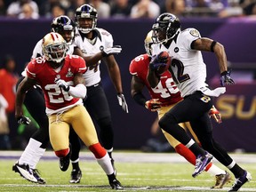 Jacoby Jones #12 of the Baltimore Ravens returns a kick-off 109 yards for a touchdown to open in the second half against Tramaine Brock #26 of the San Francisco 49ers during Super Bowl XLVII at the Mercedes-Benz Superdome on February 3, 2013 in New Orleans, Louisiana.  (Photo by Christian Petersen/Getty Images)