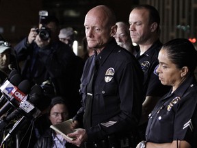 Los Angeles Police Department Commander Andrew Smith listens to a reporter's question during a media briefing outside the Police Administration Headquarters regarding former LAPD officer Christopher Dorner, February 12, 2013 in Los Angeles, California. Dorner barricaded himself in a cabin near Big Bear, California which later caught fire. (Photo by Jonathan Alcorn/Getty Images)