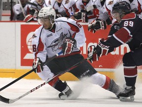 Windsor's Josh Ho-Sang, left, is checked by Saginaw's Vincent Trocheck at the WFCU Centre. (DAN JANISSE/The Windsor Star)