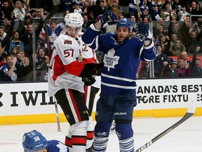 Toronto's Frazer McLaren, left, and Mike Brown celebrate McLaren's goal against Derek Grant and the Senators at the Air Canada Centre. (Photo by Abelimages/Getty Images)