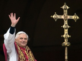 A file picture taken on April 19, 2005 shows Germany's Joseph Ratzinger, the new Pope Benedict XVI, waving to the crowd from the window of St Peter's Basilica's main balcony after being elected the 265th pope of the Roman at the Vatican City.Benedict XVI announced on February 11, 2013 he will resign on February 28 because his age prevented him from carrying out his duties, an unprecedented move in the modern history of the Catholic Church. AFP PHOTO/PATRICK HERTZOG