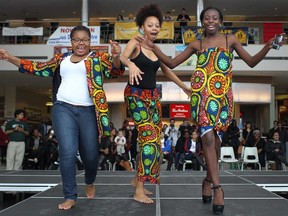 University of Windsor students Bree Tshi, 19, left, Tracy Belle, 18, and Angie Akhinagba, 20, take part in a fashion show for Afrofest in the CAW Centre, Monday, February 4, 2013. (DAX MELMER/The Windsor Star)