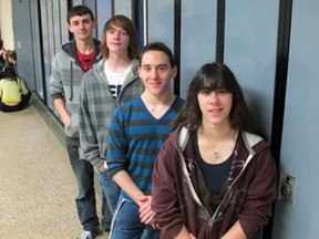 Bailey Wintermute, front, Corey Wintermute, Kess White and Tyler Johnson are Kingsville High School students honoured last week for having perfect attendance last semester. The four students, shown Thursday, Feb. 21, 2013, were part of 25 who got a pizza party celebration and certificates marking the achievement. (Monica Wolfson/The Windsor Star)