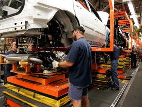 In this file photo, production of the General Motors' Chevrolet Equinox; Pontiac Torrent and the Suzuki XL7 at the CAMI Automotive facility in Ingersoll, Ont. (THE CANADIAN PRESS/Dave Chidley)