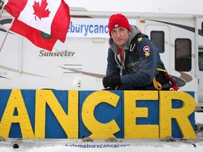 Mike Duhacek, 36, from Milton, Ont., is pictured with his sled that he will be pulling 900 km from Windsor to Ottawa, Sunday, February 3, 2013.  Duhacek is hoping to raise money for Cancer research.  (DAX MELMER/The Windsor Star)