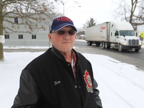 Tom Dunlop stands in front of his Comber home on February 8, 2013.  The number of trucks on county roads has increased quite a bit.   (JASON KRYK/The Windsor Star)