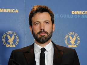 Ben Affleck poses backstage with his award for outstanding directorial achievement in feature film for "Argo" at the 65th Annual Directors Guild of America Awards at the Ray Dolby Ballroom on Saturday, Feb. 2, 2013, in Los Angeles. (Photo by Chris Pizzello/Invision/AP)