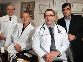 In this file photo, dialysis medicine research team leader Dr. Albert Kadri, centre right, with collegues Dr. Wasim El Nekidy, left, Dr. Derrick Soong and Dr. Maher El-Masri, are very proud of a recently published study done totally at Hotel-Dieu Grace Hospital in Windsor, Ont., January 29, 2012. Their study details the optimal dose of medication thereby reducing the number of expensive procedures for dialysis patients. (NICK BRANCACCIO/The Windsor Star).