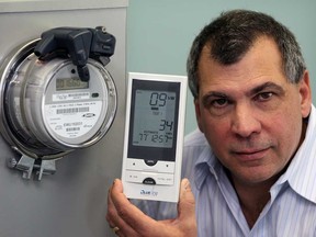 Lawrence Musyj, director, conservation and energy management at Enwin, with an in-home display for measuring energy consumption at Enwin Ouellette Avenue offices February 19, 2013.  (NICK BRANCACCIO/The Windsor Star)