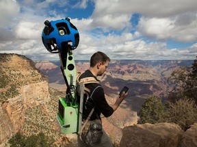 This handout image provided by search giant Google on October 24, 2012 shows Google Maps product manager Manager Ryan Falor using his Android device to control the Trekker wearable backpack with a camera system on top to traverse the Grand Canyon in Arizona. Google Maps opened a virtual path to the wonders of the Grand Canyon on January 31, 2013 by adding panoramic images gathered by hikers with Android-powered camera systems strapped to their backs. "These beautiful, interactive images cover more than 75 miles (120 kilometers) of trails and surrounding roads," Falor said in a blog post. AFP PHOTO/ HANDOUT / GOOGLEHO/AFP/Getty Images