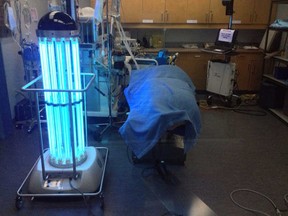 A germ-killing, UV-ray-blasting robot radiates light in a photo released by the Vancouver General Hospital on Friday, Feb. 1, 2013. The hospital has become the first in Canada to test the robot, that hospital staff have named Trudi. (THE CANADIAN PRESS/James Keller)