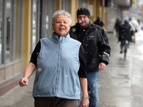 Andrea Grimes, right, walks Monday, Feb. 4, 2013, with other pedestrians on Ouellette Avenue sidewalk.  Grimes loves to walk, one of her healthy choices which has resulted in weight loss. (NICK BRANCACCIO/The Windsor Star)