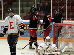 The Brennan Cardinals defeated the Essex Raiders 6-5 in Game 1 of the A/AA senior boys high school hockey final against the Essex Raiders in Essex on Tuesday, Feb. 26, 2013. Here, the Cardinals celebrate a goal by Liam Hogan. (JASON KRYK/The Windsor Star)