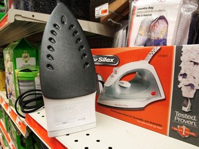 An iron sits on the shelf at Aubuchon Hardware, Thursday, Feb. 7, 2013, in Montpelier, Vt. When toymaker Hasbro axed the clothes iron token from its Monopoly game at the suggestion of online voters – replacing it with a cat – the company implied that the small household appliance was passe: something your grandmother once used to ease the wrinkles out of socks and handkerchiefs. Even with the rise of “wrinkle-free,” the iron, it seems, is holding its own. While sales in the U.S. declined in volume 1 percent last year, they were up nearly 3 percent overall between 2007 and 2012, according to Euromonitor International. (AP Photo/Toby Talbot)