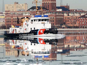 In this file photo, a U.S. Coast Guard boat navigates east Mar. 16, 2010, on a glassy smooth Detroit River. (DAN JANISSE/The Windsor Star)